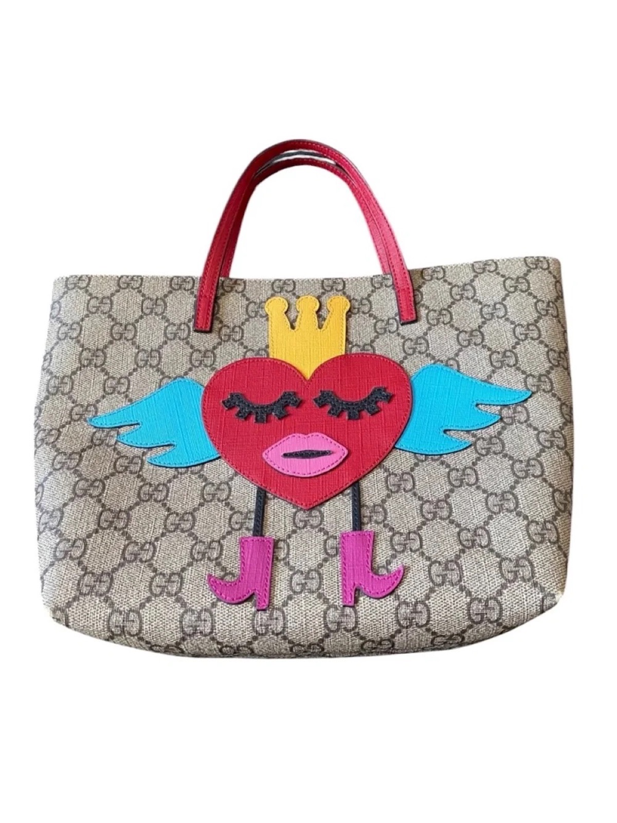 Gucci GG Supreme tote with red winged-heart appliqué