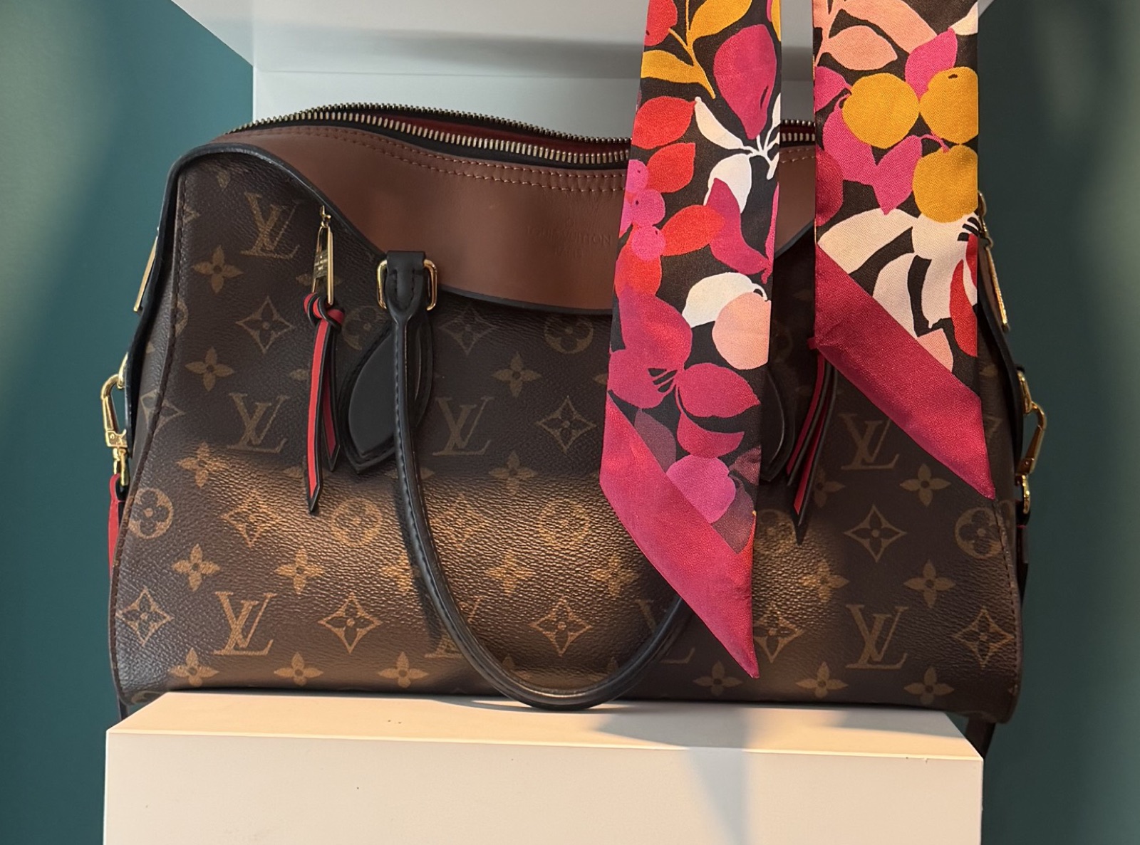Louis Vuitton Tuileries Besace in monogram canvas, styled with a floral silk scarf